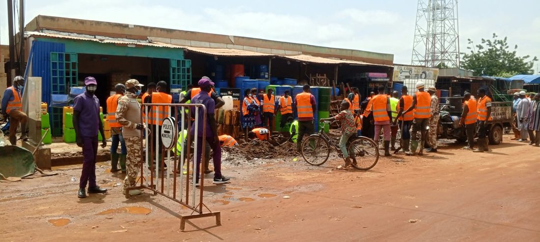 People gathering outside local buildings in Burkina Faso