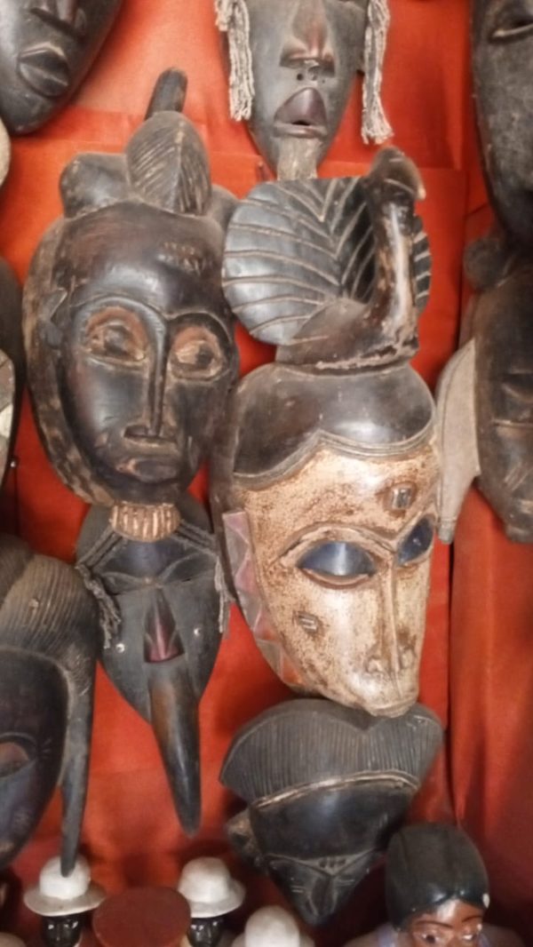 Collection of hand-carved Burkinabè masks and figures