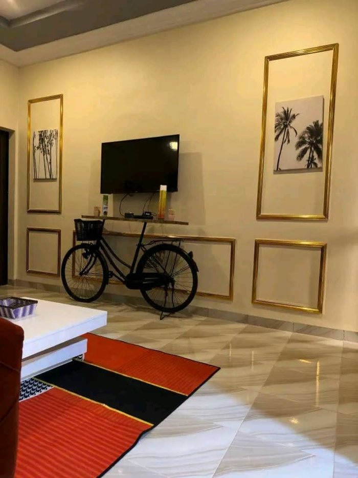 Modern living space with wall art, television and seating