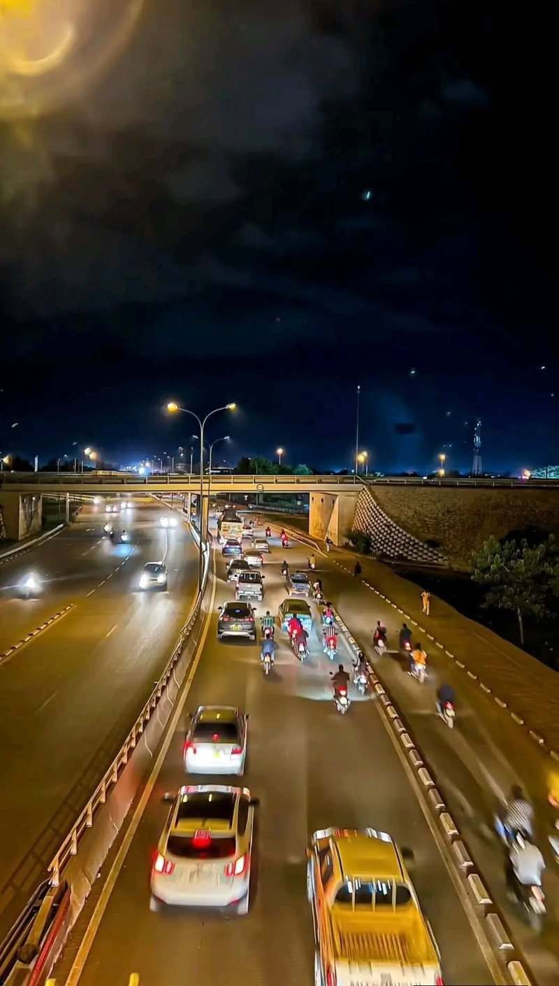 Traffic moving along an Ouagadougou road at night