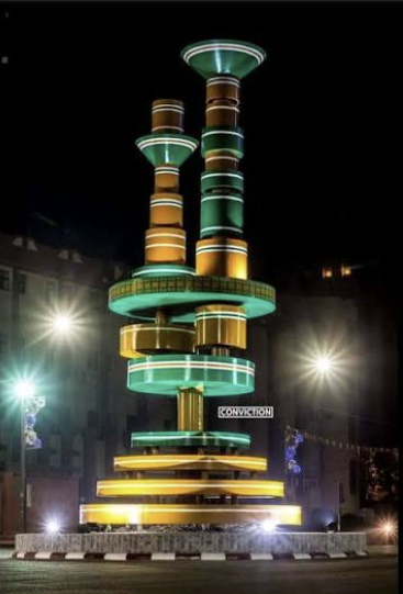 Illuminated Monument de la Conviction at night in Ouagadougou